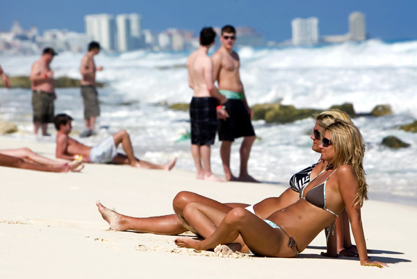 Tourists rest at Cancun beach in the Mexican state of Quintana Roo